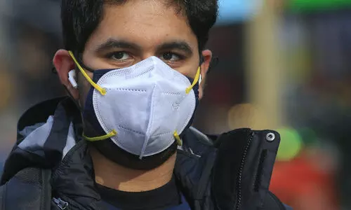 2 fitted masks may double protection against Covid-19