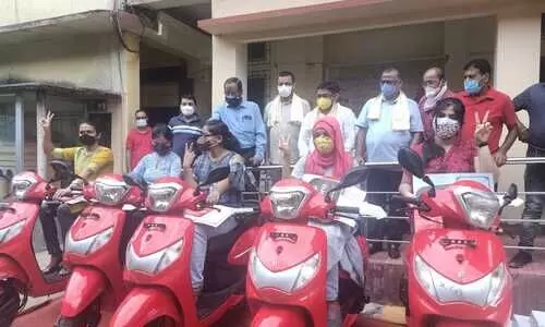 Scooties under Dr Banikanta Kakati Merit Awards distributed in Cachar