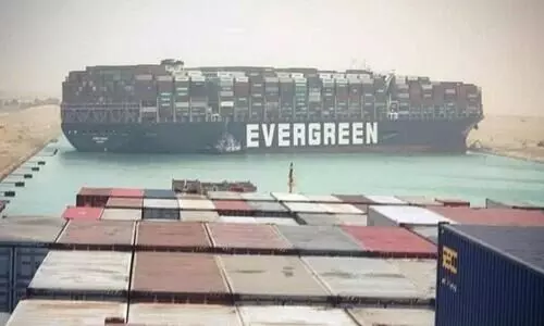 Suez Canal says deal reached to free seized vessel