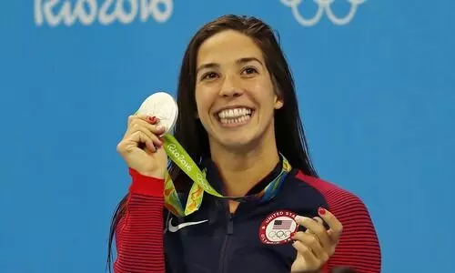 Unvaccinated US swimmer sparks debate as Olympics start