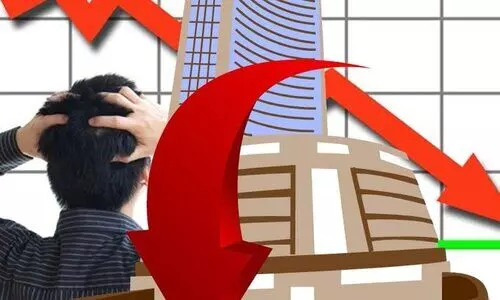 Equity indices trade lower; Sensex down by over 450 pts