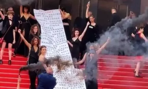 Women protesters storm Cannes premiere of Holy Spider with smoke devices