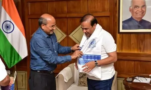 Assam University vice chancellor hands over Rs 1 lakh to CM for flood relief