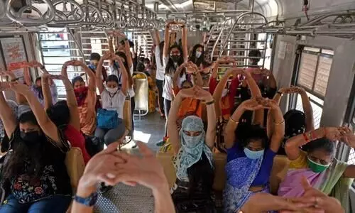 Yoga in train: Mumbai local commuters perform asanas while travelling