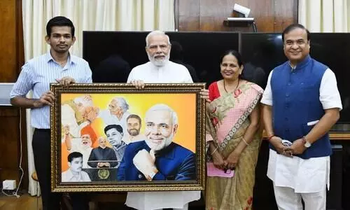 Silchar divyang artist Abhijeet Gotani presents portrait to PM
