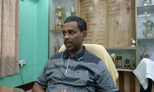 Teachers wear black badges in protest against detention of Cachar College principal