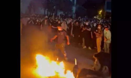 Women burn headscarves as anti-hijab protests continue in Iran