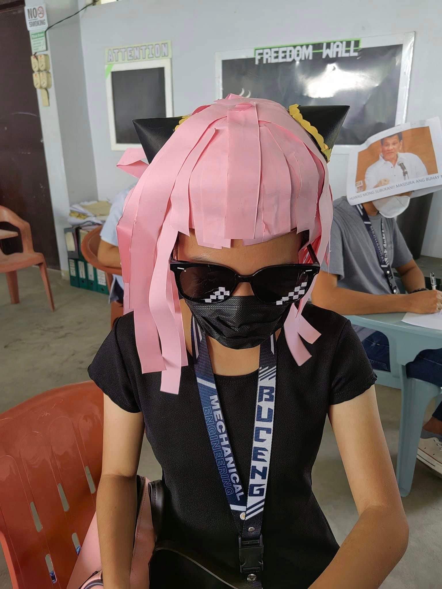 Students from Phillipines don anti-cheat head gears