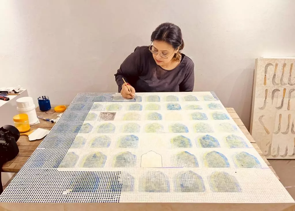 Wahida working at an art workshop with jacquard cards |Credit: Wahida Ahmed 
