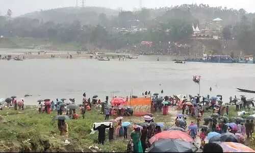 Devotees take holy dip in Barak river on Baruni