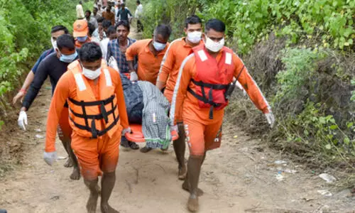 Divers search for more victims as an overloaded minitruck plunges into a canal near Ludhiana, killing six pilgrims