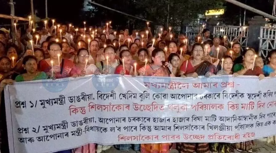 Candlelight protest by Silsako evictees in Sasal, demand land-for-land compensation Candlelight protest by Silsako evictees in Sasal, demand land-for-land compensation