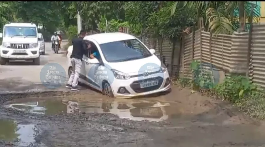 Raha residents lash out at NHAI over cratered service roads, demand urgent repairs