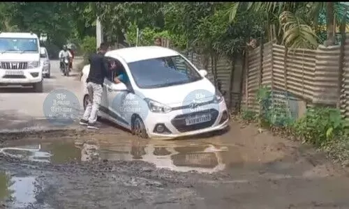 Raha residents lash out at NHAI over cratered service roads, demand urgent repairs