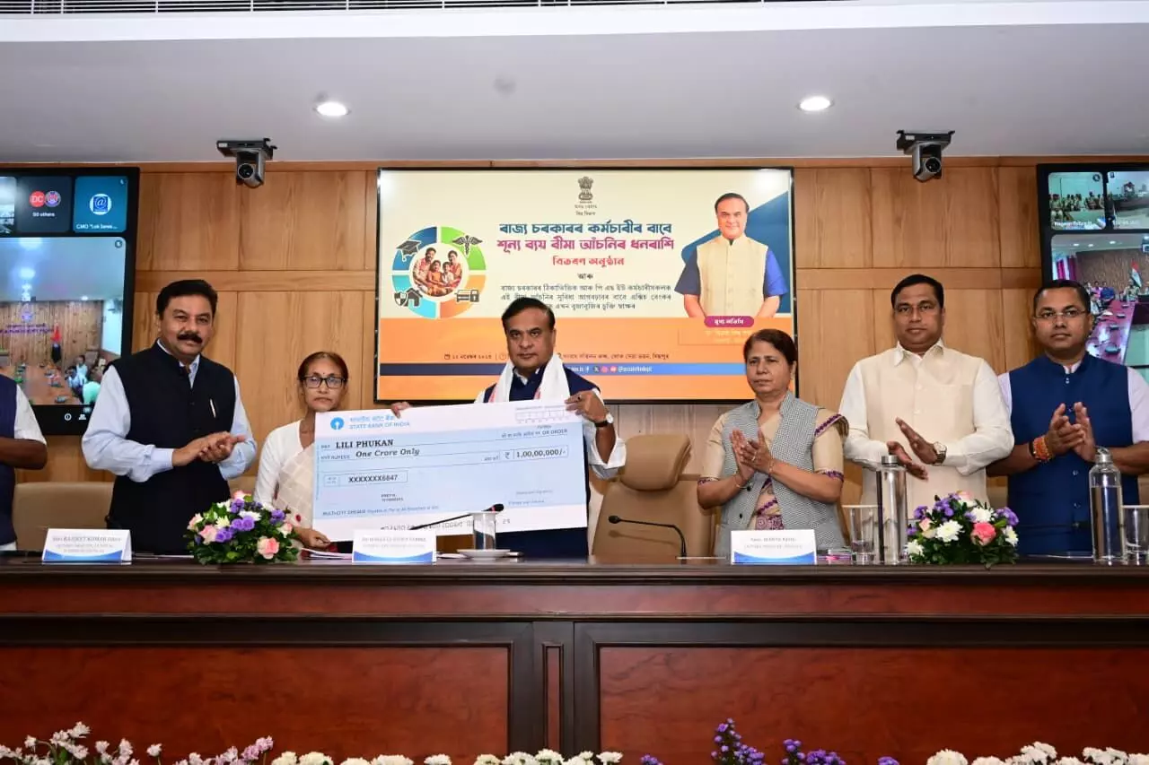 Assam extends zero-cost insurance cover to staff; CM hands cheques to 7 families Assam extends zero-cost insurance cover to staff; CM hands cheques to 7 families