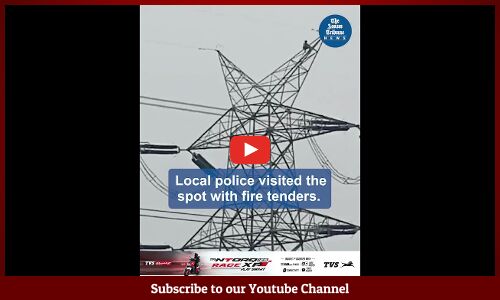 Man climbs up high-tension electricity pole in Bajali